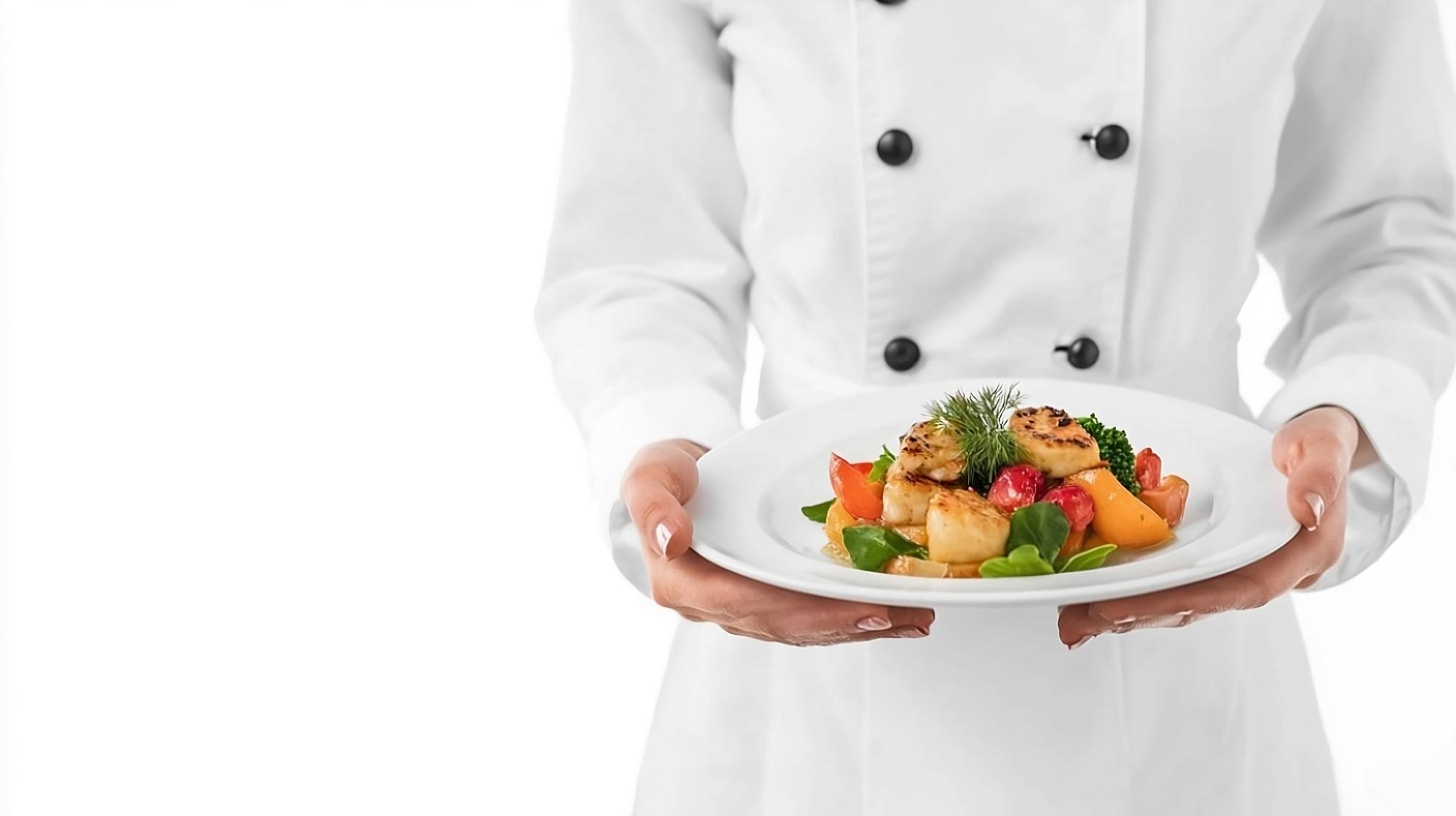 Chef offering plated course to guest