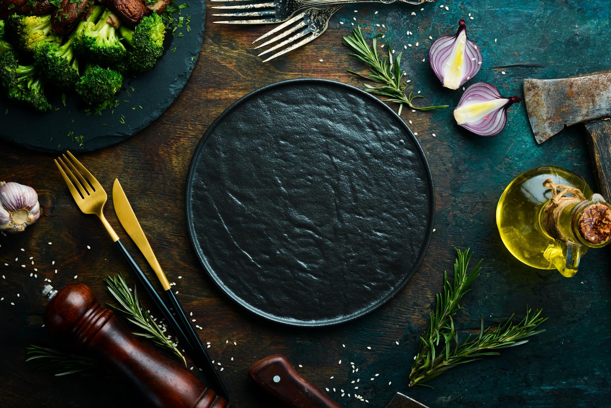 Plated tasting menu on dark slate