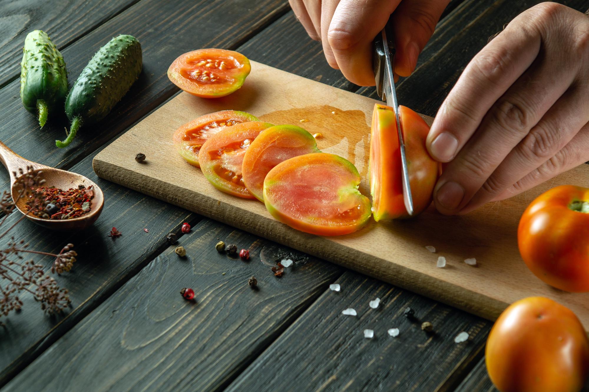 Chef slicing seasonal produce